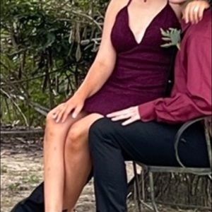This is a homecoming dress asking for 15 it is maroon only wore once .